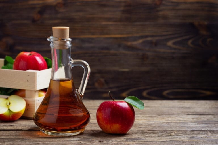 apple cider vinegar fresh red apple wooden background